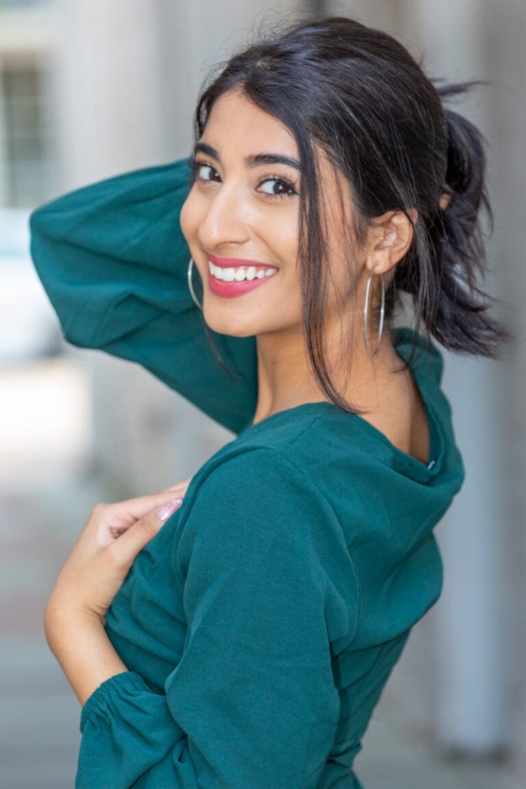 Woman in Green Long Sleeve Blouse Smiling